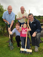 Kevin Corley Farrans Construction, Seamus Devlin Lagan Construction, Gary Curran NI Water, Claire Brown and Kristofer Reins from the NI Hospice get to work on the hospice grounds. | NI Water News